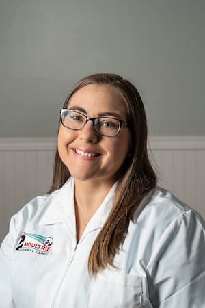 Dr. Erin Bendick wearing a white Moultrie Animal Clinic lab coat.